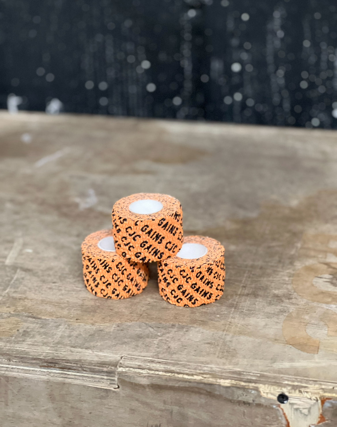 Orange Thumb & Weightlifting Tape